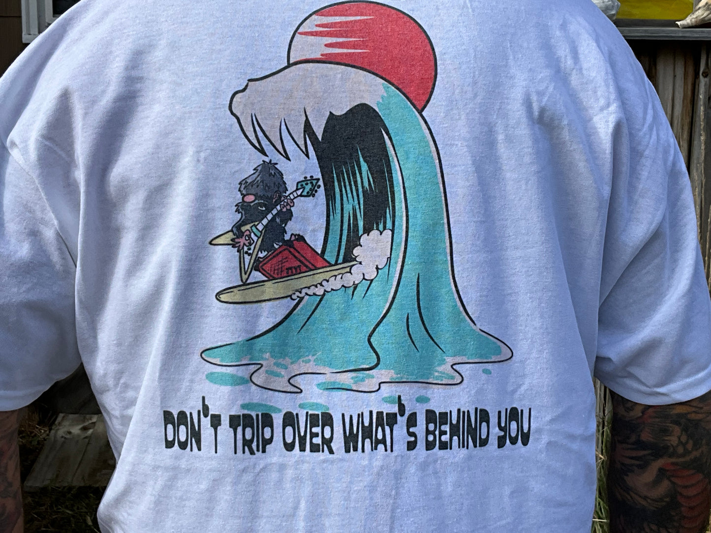 “Don’t Trip Over What’s Behind You” short sleeve tee
